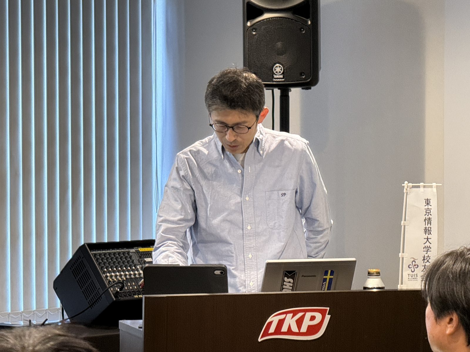 報告する瑞泉真樹副会長